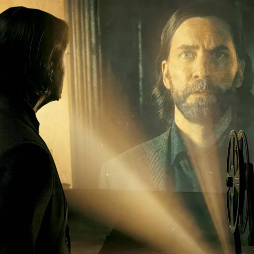 A man with a beard is standing in front of a screen.