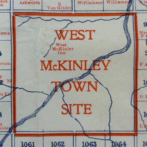 A section of a map labeled "West McKinley Town Site" with surrounding property names and numbers in blue and orange text.