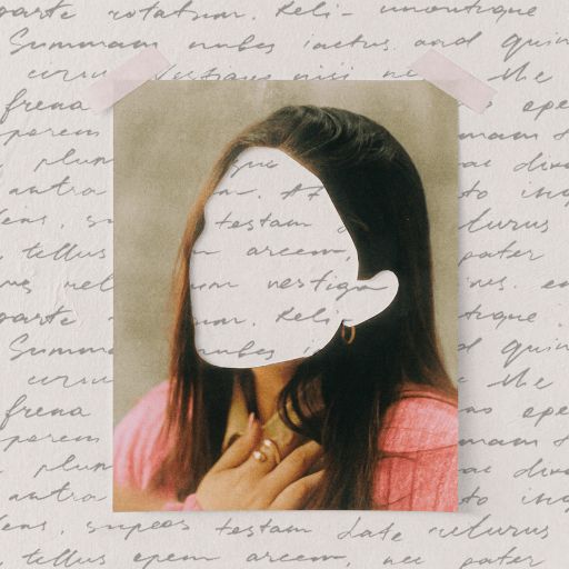 A photo of a woman with her face blanked out is taped to a background filled with handwritten writing. She wears a pink top and gold hoop earring, her hand resting near her collarbone.