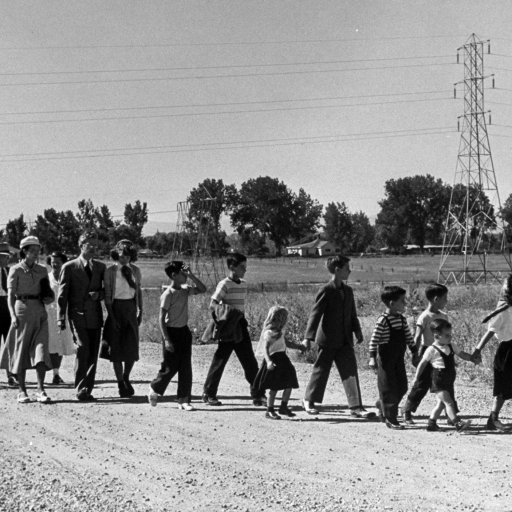 A family walking down a dirt road.