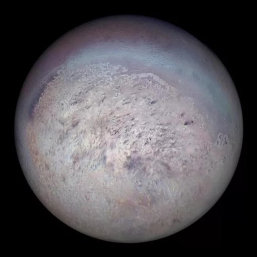 A detailed view of Neptune’s largest moon, Triton, showing its icy surface with light and dark regions, photographed against a black background.