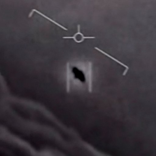 Grayscale image showing a flying object captured on radar screen with various data markings.